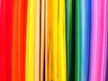 Defocused abstract background, colored stripes, vibrant rainbow colors. Materials for creativity. Colored paper.