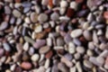 Defocused abstract background of colorful pebbles stones. A unique pattern for design, background, wallpaper Royalty Free Stock Photo