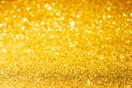 Defocused abstract colorful twinkle light background.  Gold glittery bright shimmering background Royalty Free Stock Photo