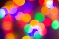 Defocused abstract multicolored bokeh lights background. Blue, purple, green, orange colors. - christmas and new year concept Royalty Free Stock Photo