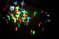 Defocused abstract multicolored bokeh lights. Orange, yellow, red colors. Blurred bokeh background in the form of a cross. Beautif Royalty Free Stock Photo