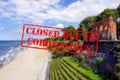 Defocused view of sandy beach, sea and ruins of church in Trzesacz. Empty and closed due to coronavirus Royalty Free Stock Photo