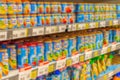 Defocused background, baby food supermarket shelves, fruit puree and porridge for feeding small children, blurred Royalty Free Stock Photo