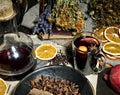 Defocused background with mulled wine, cloves, star anise, cinnamon, dry oranges, old book, vintage bottle,lavender