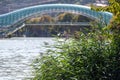 Defocused background with the Peace Bridge in Tbilisi over the Kura River Royalty Free Stock Photo