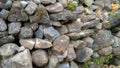 Defocused background from Pile of large stone walls, Break stone which formed from volcanic rock. Break large stone. Wild rock deb Royalty Free Stock Photo