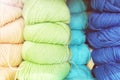 Defocused background of soft balls of wool in blue colors. The concept of coziness and comfort.