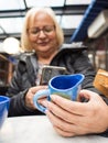 senior woman takes photos of her handmade gifts