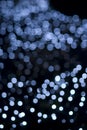 Defocused blue light dots against black background Royalty Free Stock Photo