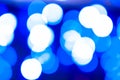 Defocused blue lights on dark blurred background with bokeh effect for wallpaper Royalty Free Stock Photo