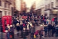 defocused blur background of people walking in a street in London, UK