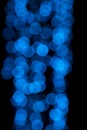 Defocused of blurred blue bokeh circle light from lighting bulb in the night for abstract background texture Royalty Free Stock Photo