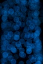 Defocused of blurred blue bokeh circle light from lighting bulb in the night for abstract background texture Royalty Free Stock Photo