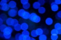 Defocused of blurred blue bokeh circle light from lighting bulb in the night for abstract background texture Royalty Free Stock Photo