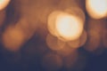 Defocused blurred bokeh abstract background, gold - yellow lights on dark Royalty Free Stock Photo