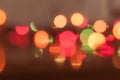 defocused blurred glowing shiny multicolored lights with reflections on dark background for wallpaper