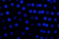 Defocused of blurred phantom blue bokeh circle light from lighting bulb in the night for abstract background texture Royalty Free Stock Photo