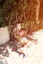 Defocused blurred photo of happy candid little kid boy of five years old is having fun on a summer vacation on a travel. child jum Royalty Free Stock Photo