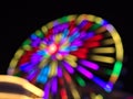 Defocused view in the dark of colorful Ferris wheel in park Wurstelprater near Wiener Prater in city Vienna, Austria. Royalty Free Stock Photo