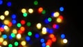 Defocused blurry multicolored blinker lights bokeh of Christmas and New year decoration lights, abstract, dark background, overlay Royalty Free Stock Photo