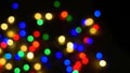 Defocused blurry multicolored blinker lights bokeh of Christmas and New year decoration lights, abstract, dark background, overlay Royalty Free Stock Photo