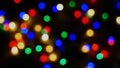 Defocused blurry multicolored blinker lights bokeh of Christmas and New year decoration lights, abstract, dark background, overlay Royalty Free Stock Photo