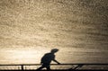 Defocused blurry shadow silhouette of a man walking Royalty Free Stock Photo