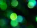 Defocused bokeh circle green and blue night lights background texture. Royalty Free Stock Photo