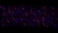 Defocused bokeh flashing lights on a black background, seamless loop. Motion. Seamless loop moving diagonal glowing