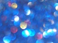 Defocused bokeh light, blue, red and yellow blurry sparkles, background