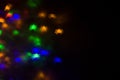 holidays, decoration and party concept - defocused bokeh multicolor lights in shape of spiders for halloween background. copy spac