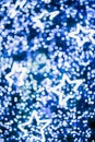 Defocused bokeh and star. Twinkling light warm tone bokeh abstract background for Christmas and Happy new year holiday. Festive e Royalty Free Stock Photo