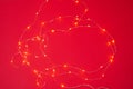 Defocused Christmas background with Blurred golden lights on red background Royalty Free Stock Photo