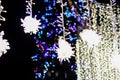 Defocused christmas lights with snowflakes colorful bokeh background. Royalty Free Stock Photo