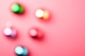 Defocused Christmas New Year composition. Gifts, colorful ball decorations on pink background Royalty Free Stock Photo