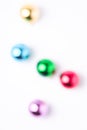 Defocused Christmas New Year composition. Gifts, colorful ball decorations on white background Royalty Free Stock Photo