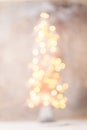 Defocused christmas tree silhouette with blurred lights. Royalty Free Stock Photo