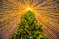 Defocused christmas tree silhouette with blurred lights Royalty Free Stock Photo