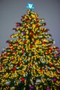 Defocused christmas tree silhouette with blurred lights Royalty Free Stock Photo