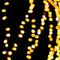 Defocused city gold night bokeh abstract background. blurred many round yellow light on dark background Royalty Free Stock Photo