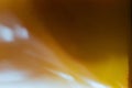 Defocused closeup shot of brown-yellow analog photograph burns. Abstract and symbolism of old-time photography.