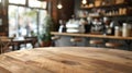Defocused coffee shop background with a round wooden tabletop counter, perfect for product or text display. Empty round