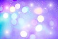 Defocused colorful ligths of Christmas tree. Multicolored bokeh lights during a snowfall. Background for greeting card. Royalty Free Stock Photo