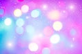 Defocused colorful ligths of Christmas tree. Multicolored bokeh lights during a snowfall. Background for greeting card. Royalty Free Stock Photo