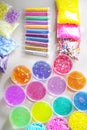 Defocused colorful slimes inside plastic boxes. Set of kids gunk toy, close up view. How to make fluffy slime at home