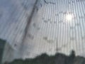 Defocused curtain behind window with slightly sun light Royalty Free Stock Photo