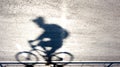 Defocused cyclist silhouette and shadow