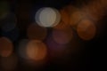 Defocused dark street background with bright circles of light. Abstract concept with copy space Royalty Free Stock Photo