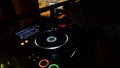 Defocused DJ spinning, mixing, and scratching in a night club. Night life and electronic music concept Royalty Free Stock Photo