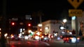 Defocused evening street. Lights of city, cars on rainy night. Road in soft focus. Twilight in USA. Royalty Free Stock Photo